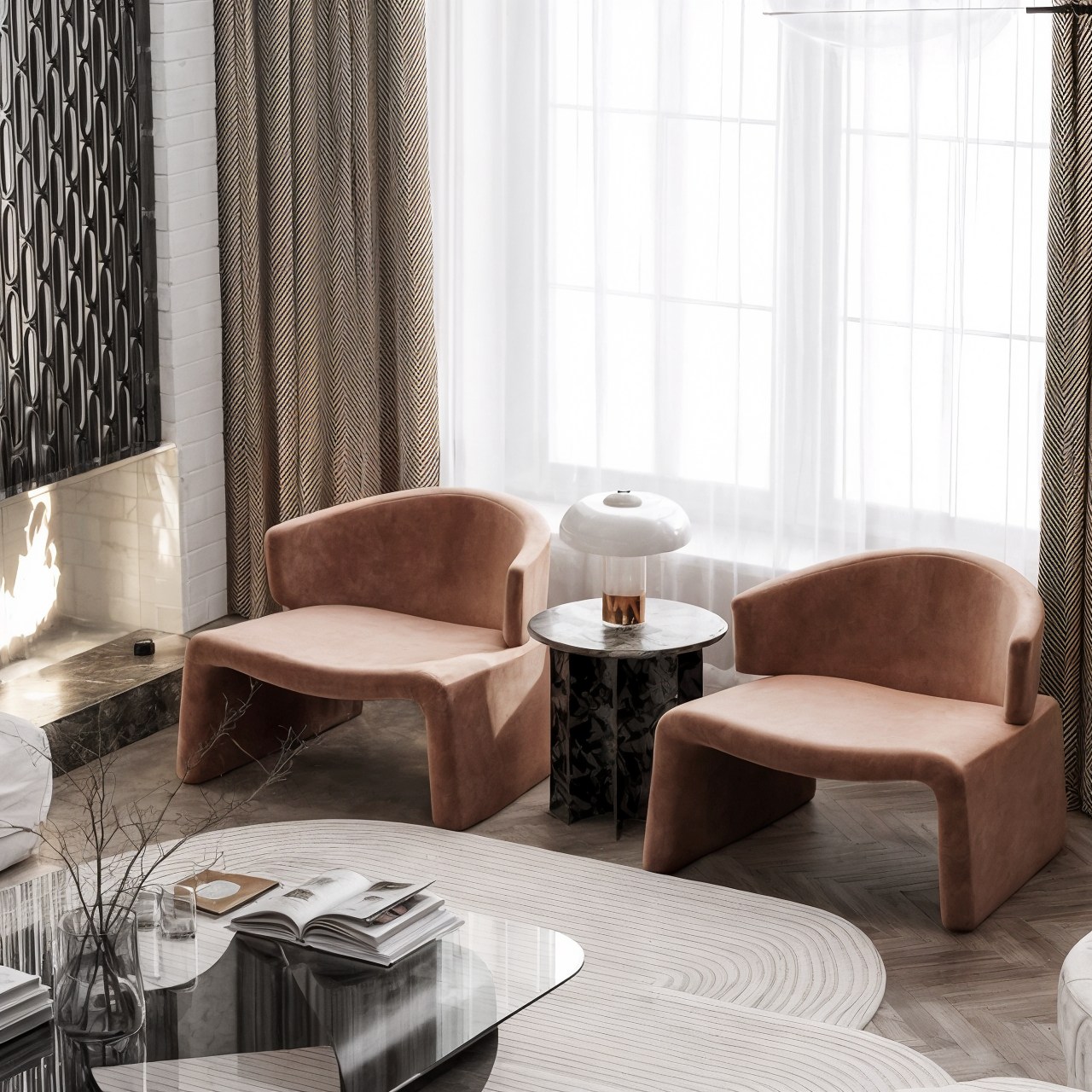 Pair of rust-colored lounge chairs beside a small stone table and floor-to-ceiling curtains.