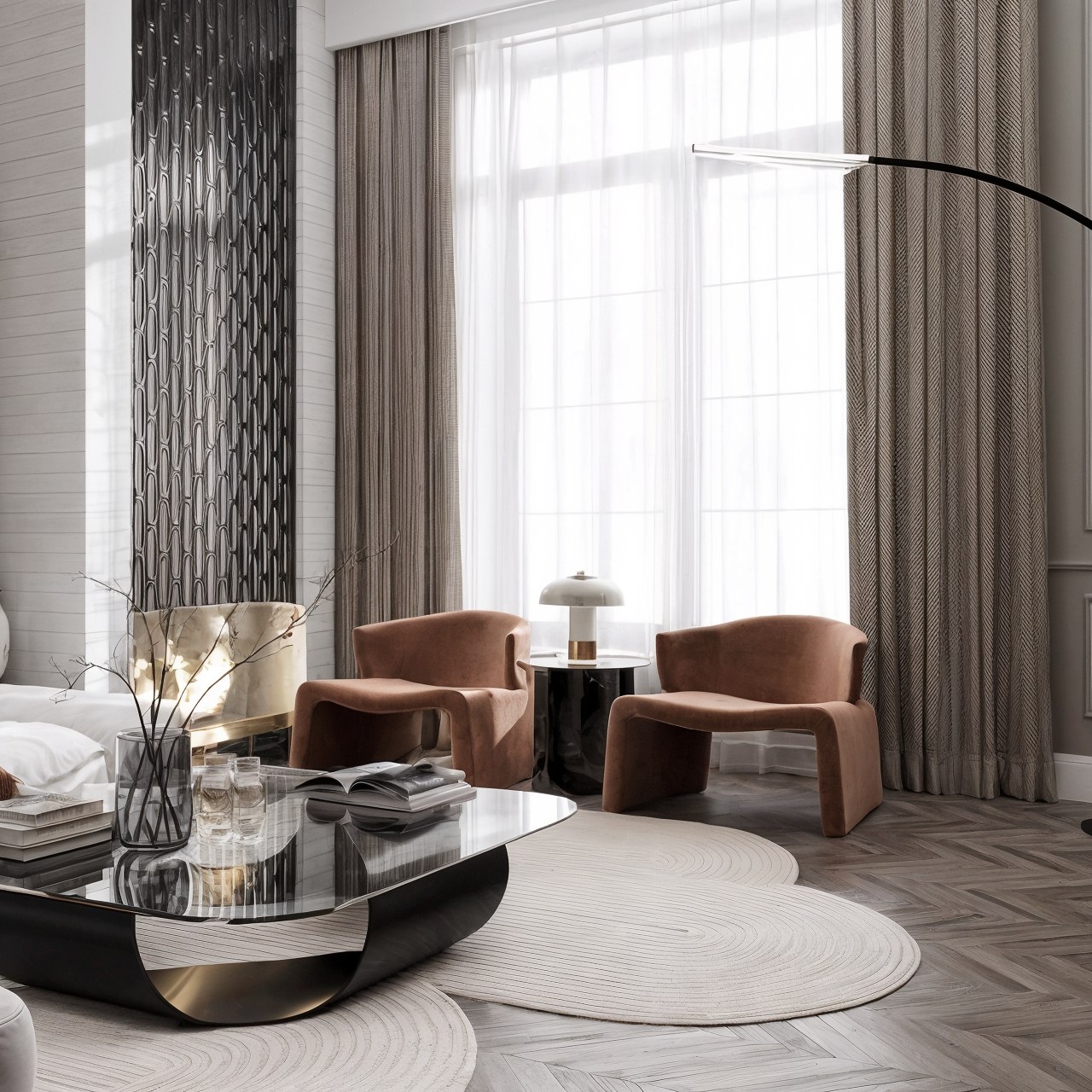 Living room with tall windows, rust-toned lounge chairs, layered rugs and sculptural lighting.