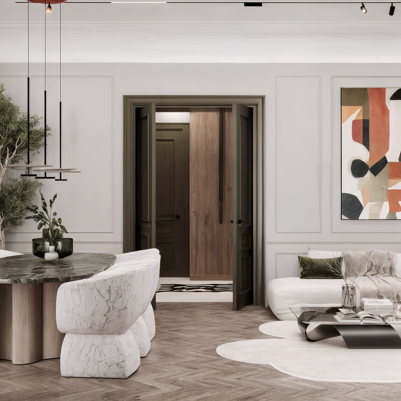 Elegant living area with white sofa, paneled walls, dark timber doorway and abstract art.
